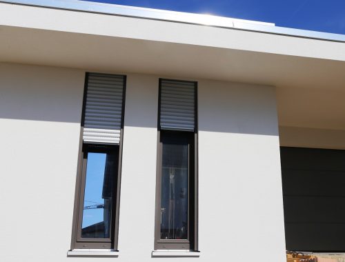 Vertical plastic windows on a modern bungalow